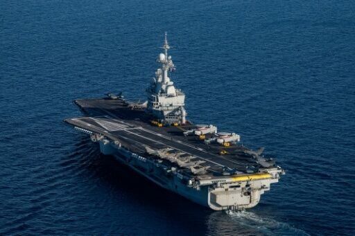 France's Charles de Gaulle aircraft carrier its escorts were transiting the Suez Canal, the defence ministry said