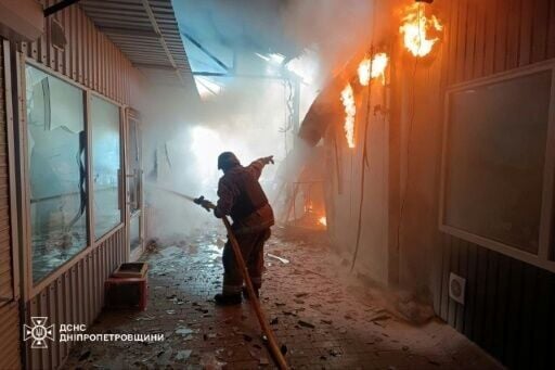 Ukraine's State Emergency Service released images of its firefighters at the scene of the strike on the market in Nikopol