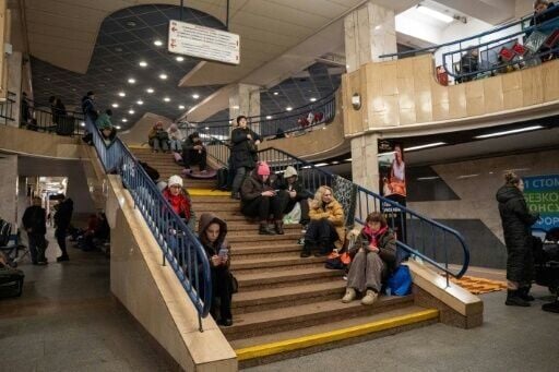 People take shelter at a metro station during a Russian drone and missile attacks on Kyiv