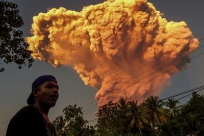 Indonesia volcano spews colossal ash tower, alert level raised