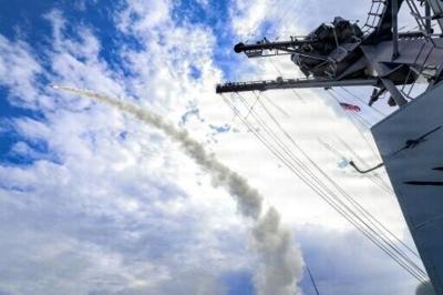 This US Navy handout photo shows the Arleigh Burke-class guided-missile destroyer USS Thomas Hudner (DDG 116) firing a Tomahawk land attack missile in support of Operation Epic Fury