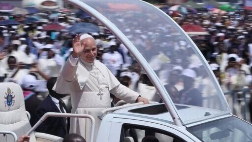 Pope waves to Angola crowds from Popemobile ahead of mass