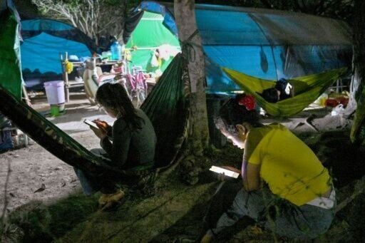 People, displaced from their homes after clashes between Thai and Cambodian soldiers, at an evacuation centre on the grounds of a pagoda in Banteay Meanchey province on February 4, 2026