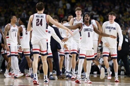 Malachi Smith and Braylon Mullins of the University of Connecticut Huskies celebrate their NCAA Tournament Final Four victory over the University of Illinois