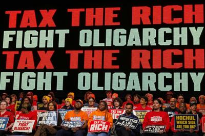 People attend a Tax The Rich rally hosted by the Democratic Socialists of America in the Bronx, N.Y., on March 29, 2026.