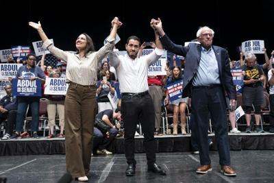 Rep. Alexandria Ocasio-Cortez, Michigan candidate Abdul El-Sayed and U.S. Sen. Bernie Sanders at "The People v. The Powerful" rally at the Detroit Opera House on July 18, 2026.