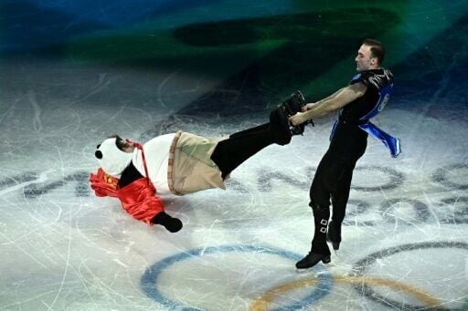Kazakhstan's Mikhail Shaidorov in a panda costume and Georgia's Luka Berulava perform at the Olympic figure skating exhibition gala