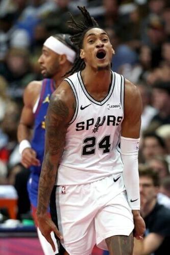 Devin Vassell of the San Antonio Spurs reacts after a three point basket in the fourth quarter of an NBA Cup group stage win over the Denver Nuggets