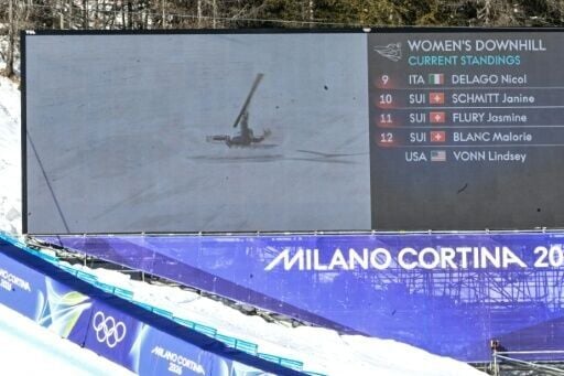 A giant screen shows Lindsey Vonn crashing as she competes in the Cortina downhill