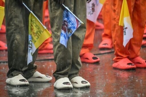 Pouring rain marked the visit by Pope Leo XIV to Bata Prison