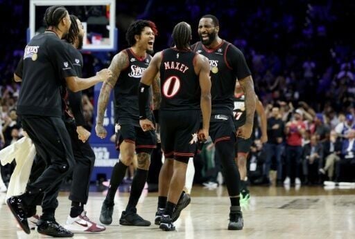 Andre Drummond celebrates a three-pointer with Philadelphia 76ers teammates Tyrese Maxey and Kelly Oubre Jr. during the Sixers' NBA play-in victory over the Orlando Magic