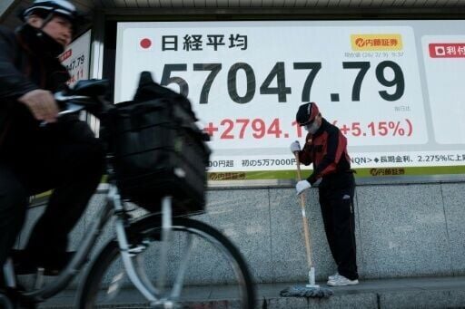 Investors pushed Tokyo's benchmark Nikkei 225 index above 57,000 points for the first time following Prime Minister Sanae Takaichi's resounding victory in a snap parliamentary election