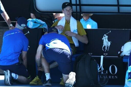 Jannik Sinner gets medical attention between games against Eliot Spizzirri