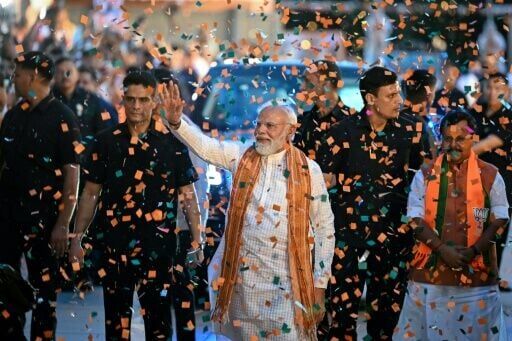 Prime Minister Narendra Modi waves to supporters at BJP party headquarters in New Delhi