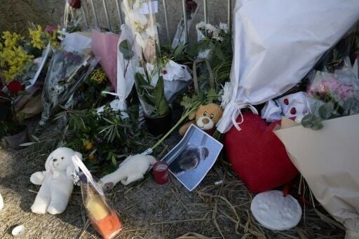 Fans left flowers near a barrier leading to her home in Saint-Tropez