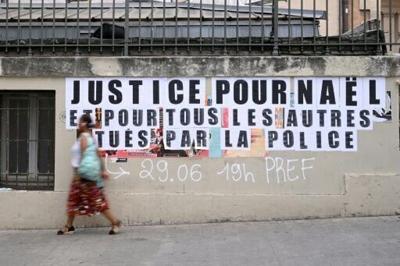 'Justice for Nahel and for all the others killed by police': a message plastered on a wall in the southern city of Marseille in June 2023