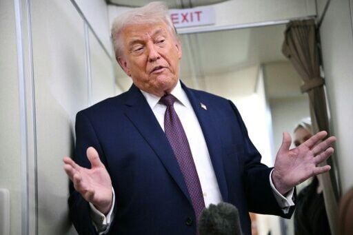 US President Donald Trump, pictured on Air Force One on January 22, 2026, has struck a conflicted tone over the second fatal shooting by federal agents in Minneapolis