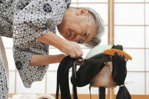 After a craftsman creates the wigs using human hair, wig masters like Tadashi Kamoji style them