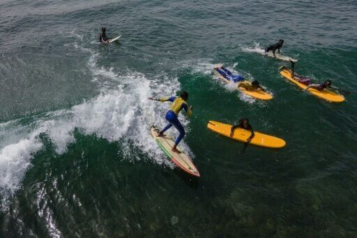The girls from the Surf Academy get to surf Dakar's world-class, year-round waves that attract people from across the globe