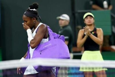 American Coco Gauff departs the court after retiring from her third-round match at Indian Wells with a left arm injury