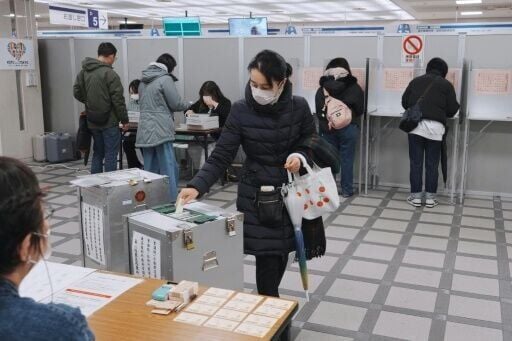 A voter at a polling station in Tokyo on February 8, 2026
