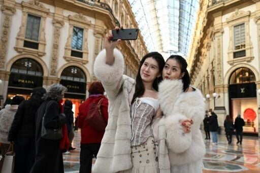 Tourists at the Vittorio Emanuele II gallery in Milan ahead of the Olympic Games