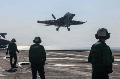 A US Navy photograph shows an F/A-18F Super Hornet landing on USS Abraham Lincoln in the Arabian Sea on January 30, 2026