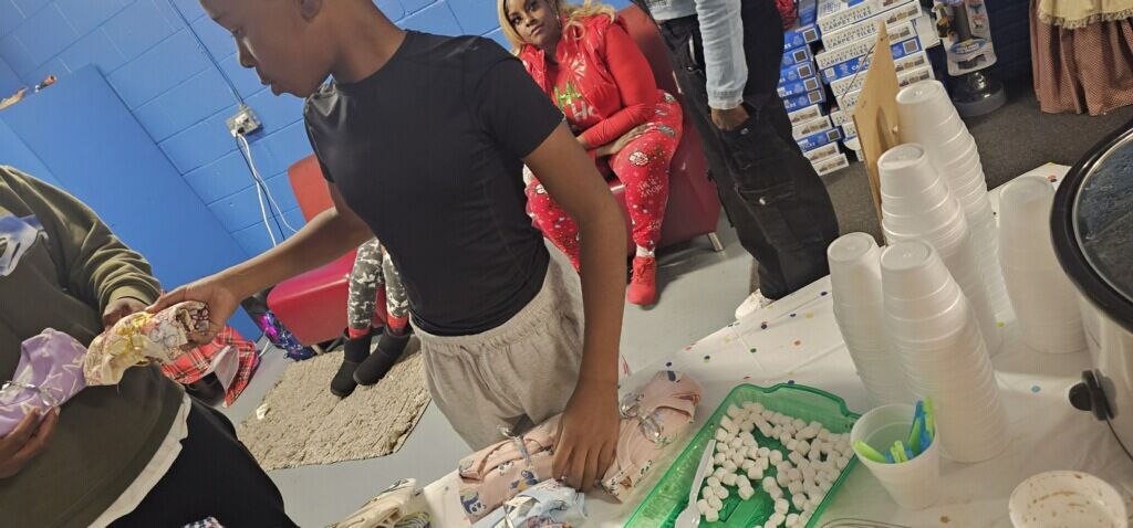 Rudy Evans gives toys