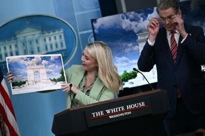 White House Press Secretary Karoline Leavitt shows off an artist's rendering of President Donald Trump's planned Triumphal Arch