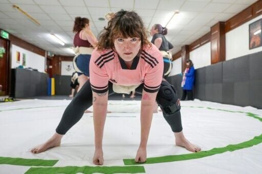 Toraigh Mallon poses for a photo during a training session at a sumo wrestling club in Belfast