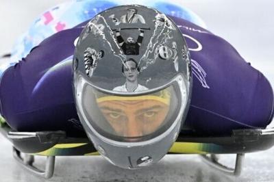 Vladyslav Heraskevych sliding in the helmet that honoured slain Ukrainian athletes