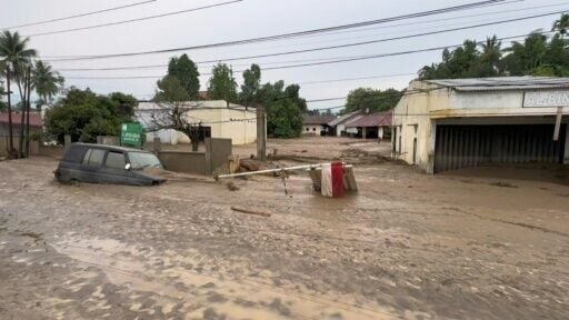 Homes and roads coated in mud after deadly floods hit Indonesia's Aceh