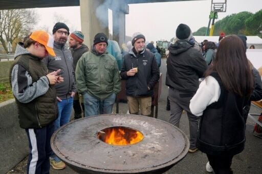 Farmers take part in the blockade of the A64 motorway to protest the culling of cows due to a skin disease in southwestern France