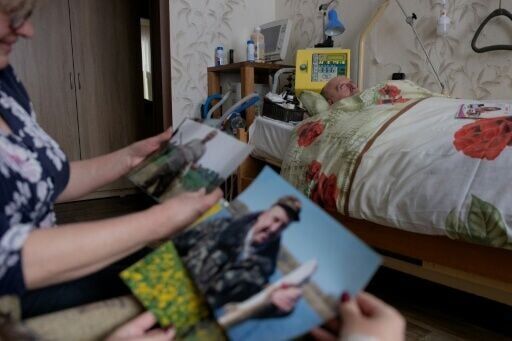 Photos of a younger Kuchynsky show him fishing and crouching in the middle of a bright yellow rapeseed field