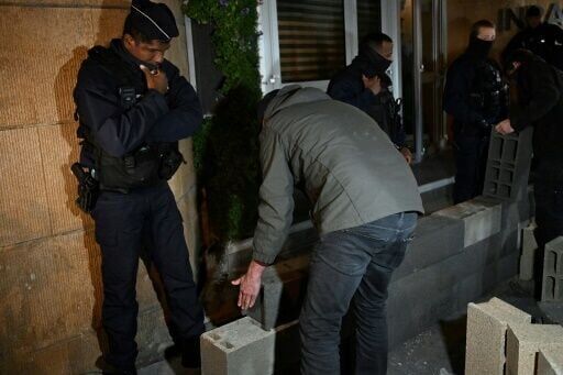 French farmers wall off public buildings in protest over regulations