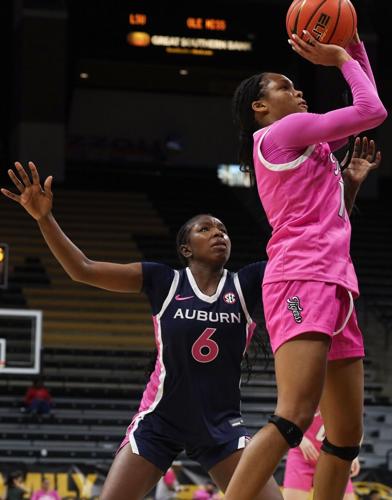 Mizzou guard Jayla Smith (11) aims for the hoop as Auburn guard Khady Leye (6) guards
