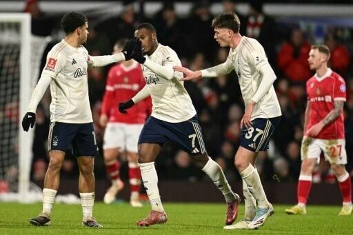 Callum Hudson-Odoi (C) scored two late goals to give Nottingham Forest a 3-3 draw with Wrexham before losing the penalty shoot-out