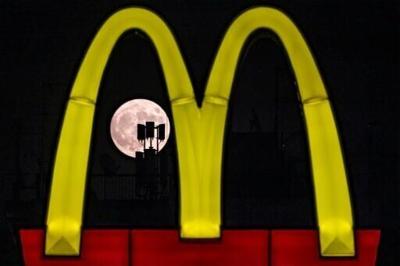 McDonald's profits dented by food poisoning outbreak