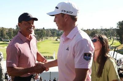 American Jacob Bridgeman is congratulated by tournament host Tiger Woods after winning the PGA Tour Genesis Invitational at Riviera Country Club