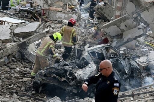 Israeli rescue teams still search for missing people after a deadly Iranian missile strike