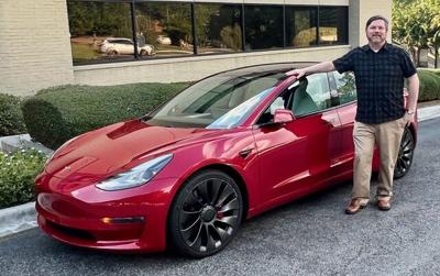 Mike Shaw with electric vehicle