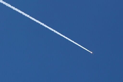 A rocket trail is seen in the sky above the Israeli coastal city of Tel Aviv on March 5, 2026