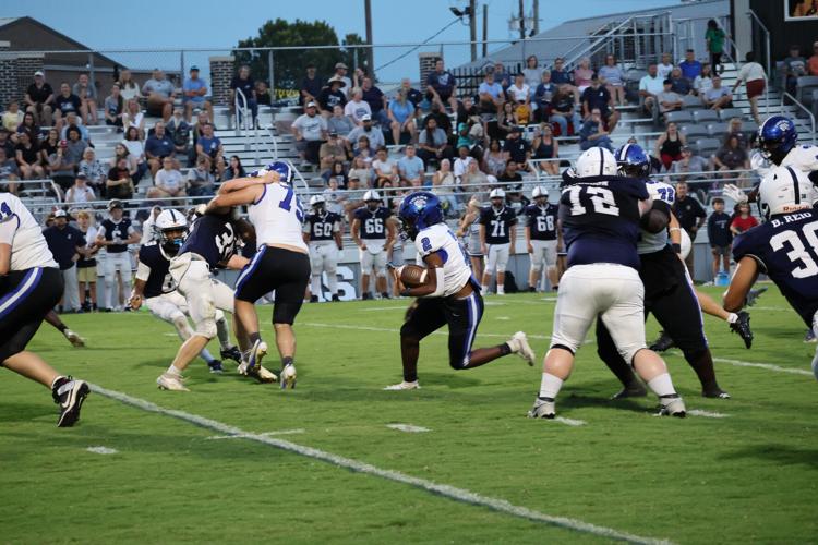 Demopolis football runner