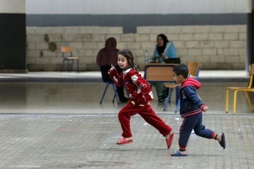 Displaced Lebanese children playing in a school-turned-shelter