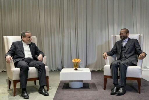 Iranian Foreign Minister Abbas Araghchi (L) meets with his Omani counterpart Badr Albusaidi in Geneva ahead of fresh negotiations with the US