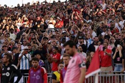 Fans at Toronto's BMO field take pictures of Inter Miami CF star Lionel Messi