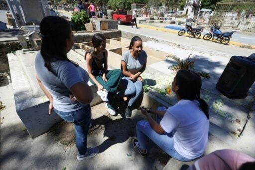 On Sunday, Saul's parents were joined by his girlfriend and friends at the cemetery in southern Caracas