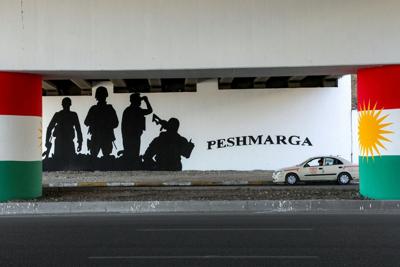 Graffiti depicts the Kurdish flag and the name of the Kurdish Peshmerga forces in Irbil, the capital of Iraq's northern semi-autonomous Kurdish region, on Oct. 4, 2026.