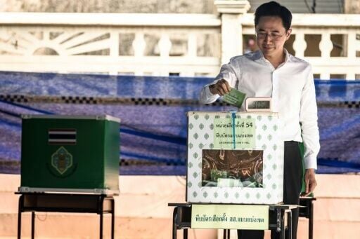 Pheu Thai Party's prime ministerial candidate Yodchanan Wongsawat casts his ballot in Thailand's general election at a polling station in Bangkok