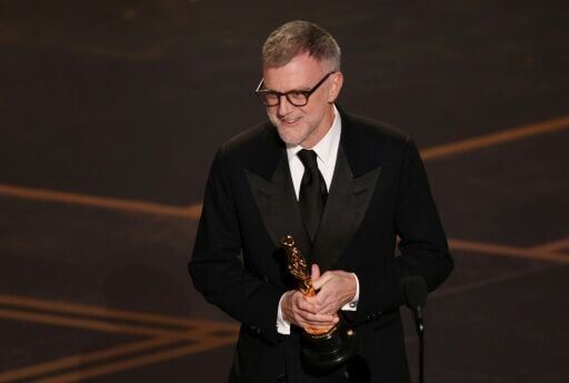 Paul Thomas Anderson accepts the Oscar for Best Writing (Adapted Screenplay) for "One Battle After Another" at the 98th annual Oscars